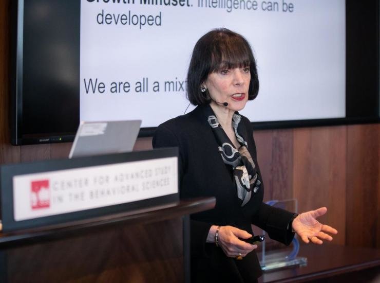 Carol Dweck in front of a slide that reads “Growth mindset: intelligence can be developed”