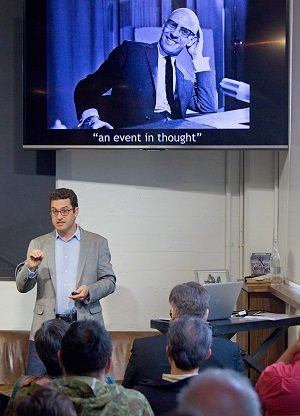 Andrew Lakoff speaking in front of an audience